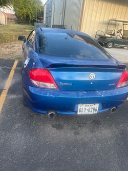 Blue car 2 door Hyundai