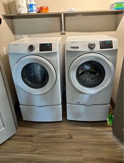 Front load washer and dryer with pedestals