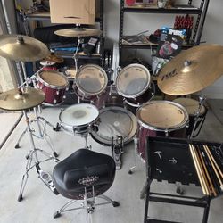 Drumset with books, implements and accessories