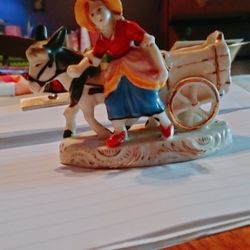 little porcelain girl with donkey toothpick holder