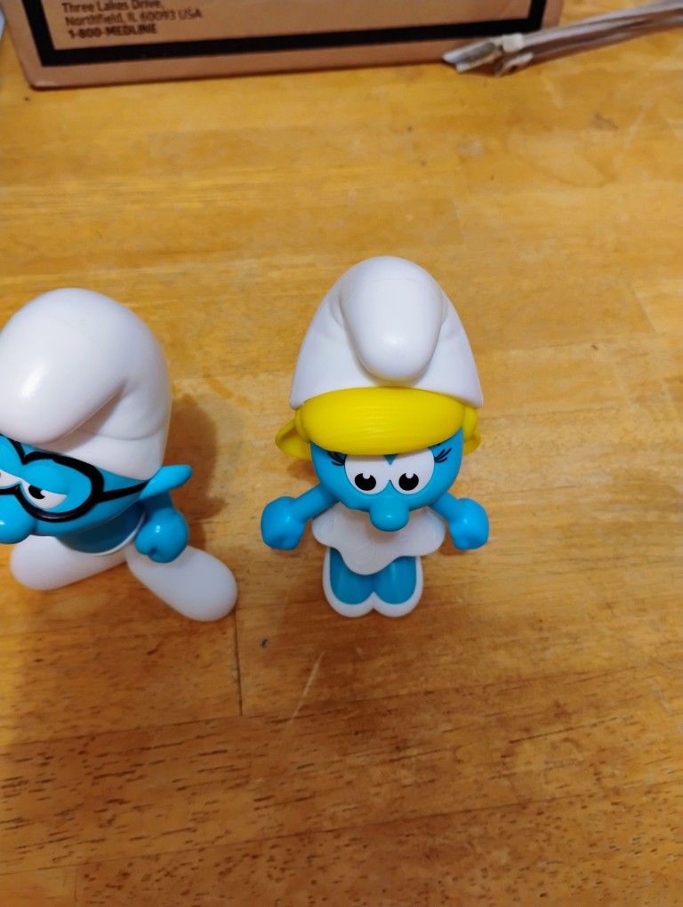 Smurfette And Inert Smurf And Two Power Rangers