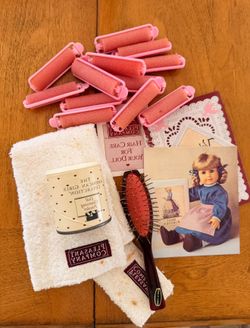 Brush, dry shampoo, and curlers for dolls
