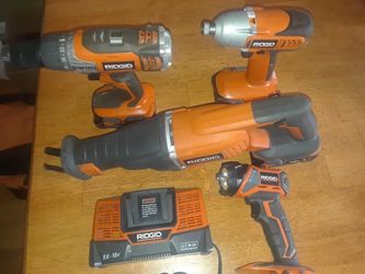 Bargain Ridgid 18 volt 4 tool kit with batteries charger and Commercial tool bag