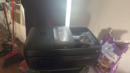A used hp jet 3830 printer with ink