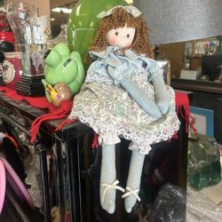 Vintage-style rag doll features curly auburn hair