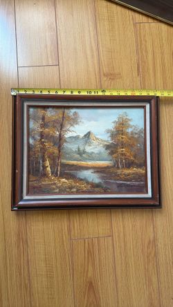 oil-on-canvas-board depicting an alpine mountain scene. The signature in the lower right looks like it may read something similar to “T. Whitman”