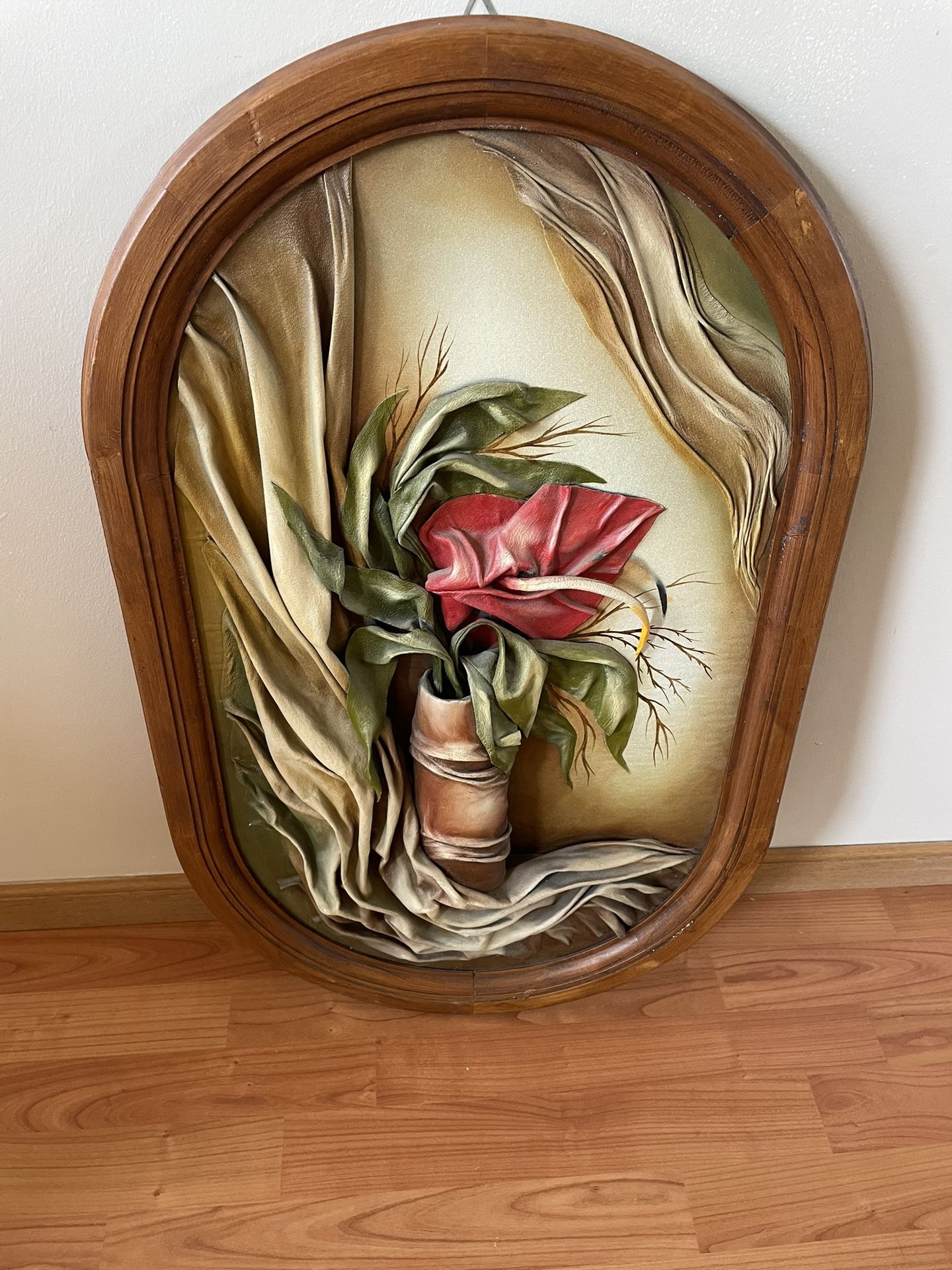 Flower made of leather in a frame