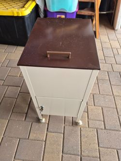 Vintage rolling metal file cabinet with key door $50