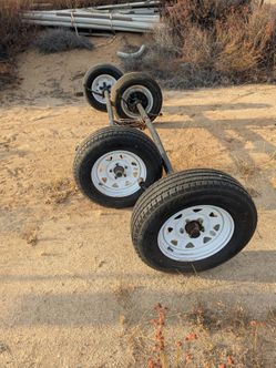 Five lug trailer axles with tires and rims