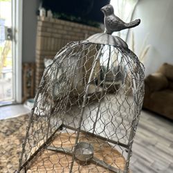 Bird Cage Holds A Small Candle 