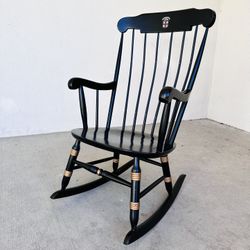 Black Wooden Rocking Chair With Brown University Emblem 