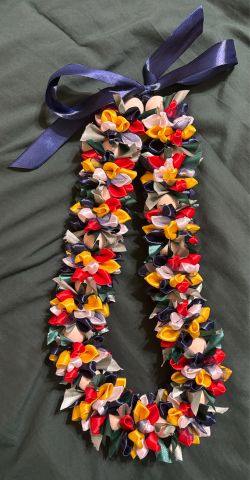 Handmade multicolor satin flower ribbon lei.