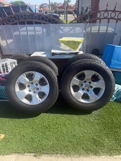 4 Ram Wheels and tires 18 inch alloy 32 inch all terrain