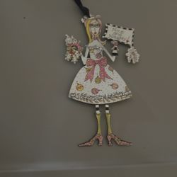 Vintage ladies Christmas ornaments made out of metal