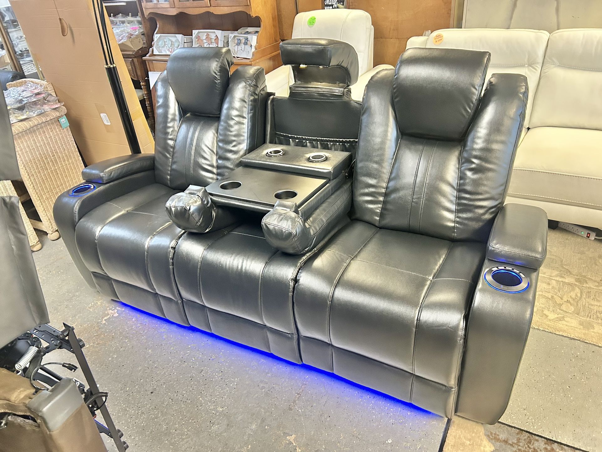 Like New 3 Months Old Leather Electric Dual Reclining Couch With Electric Headrests And Dual USB And Wireless Charging Stations And LED Lighting