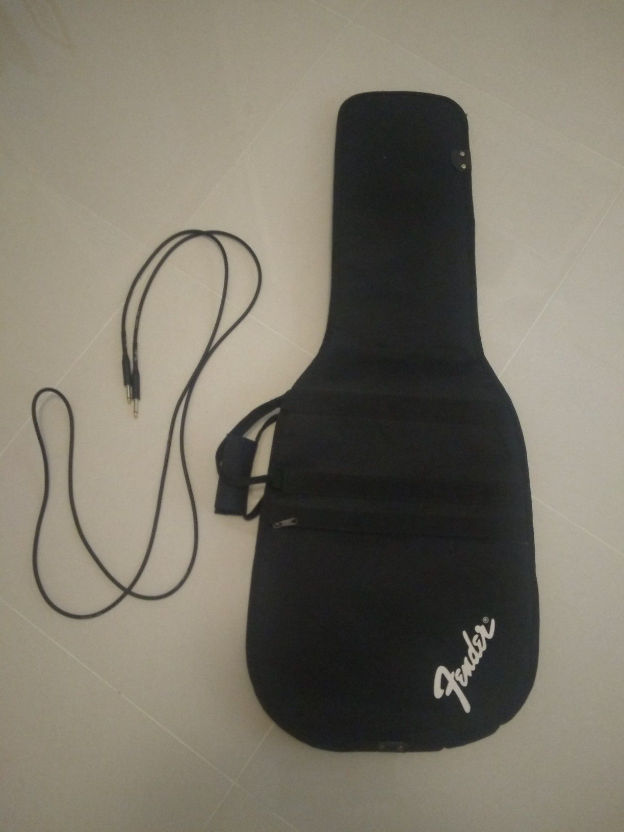 Guitar gig bag and cable