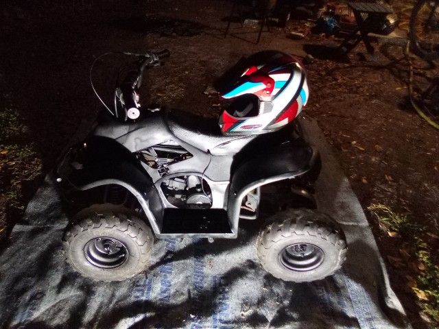 All Terrain 4 Wheeler (W, helmet)