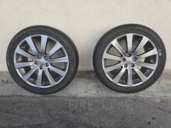 (2) Subaru 17 inch 10 spoke OEM rims with new tires 17 X 7 (5X100) Only 2 rims with tires.
