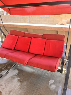 Swing and 4 Pillows Used Like New 