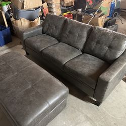 grey brand new small couch and ottoman in great condition 
