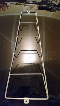 Ikea magazine/lids wall/cabinet rack.