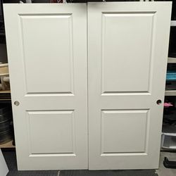 71 3/8” x 79 1/2” Double interior doors, used for closets. 2-panel design.