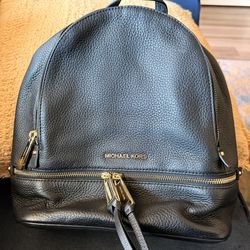 Black and gold Michael Kors backpack