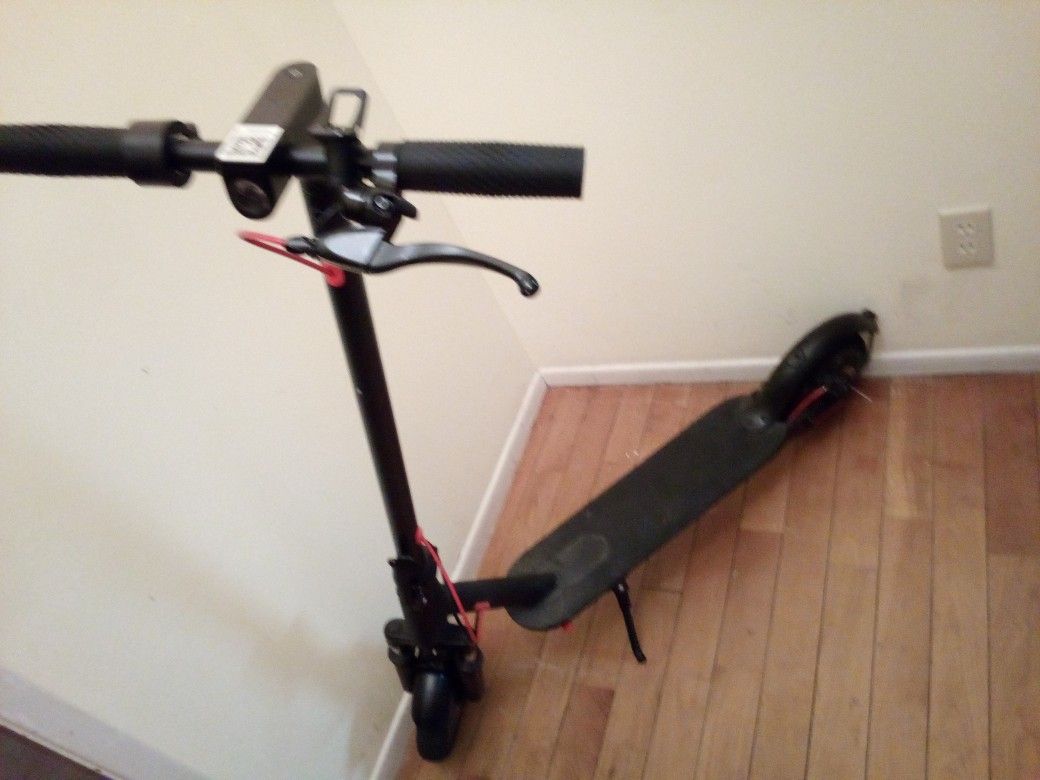Two-wheel Front Wheel Scooter Asking $100 Firm Comes With Battery Charger Works Great Use Like New