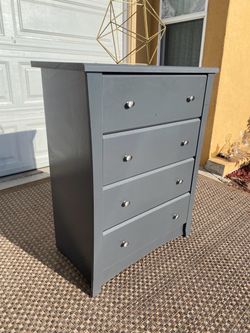 Gray dresser with 4 drawers