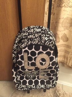 Justice rolling bag $35