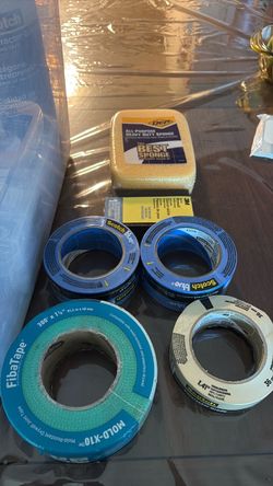 Two blue tapes, one masking tape, Drywall, sander sponge, fair tape Two blue tapes, one masking tape, Drywall, sander sponge, fiba  tape