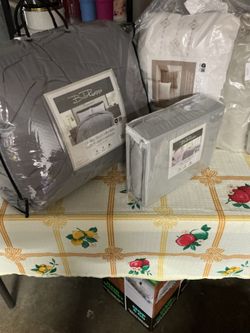 Colcha y sábanas y cojines