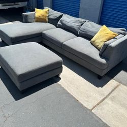 Gray Sectional Couch And Ottoman, 
