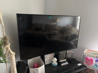 Large Flat Screen TV with Stand