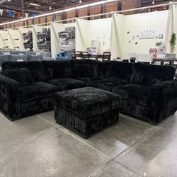 BRAND NEW BLACK FLUFFY CORDUROY SECTIONAL WI OTTOMAN