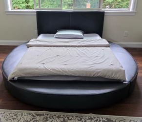 Round queen black bed