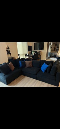 Black Plush Velvet Couch With Additional Pillows