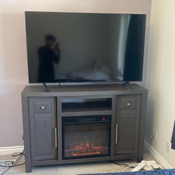 50 inch Samsung w/ tv counter fire place 