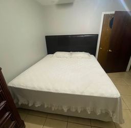 King size bed with black headboard