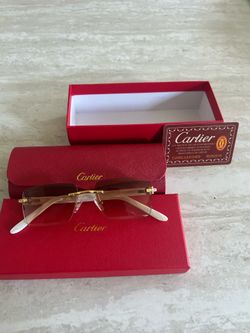 Gold and white Cartier glasses