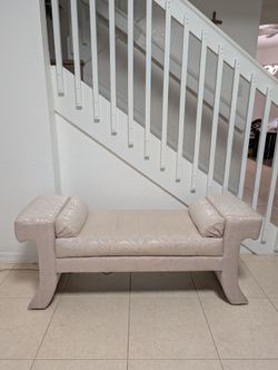 Upholstered champagne bench with bolster pillows