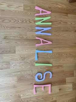 Whimsical Wooden letters about 8” tall. Perfect for your daughter’s room