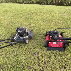 Two Gas Lawn Mowers Works