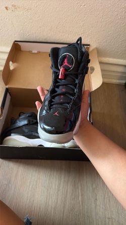 Air Jordan 11 Black Patent Leather Sneakers