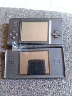 Nintendo DS lite para partes esta quebrado El lado donde se dobla