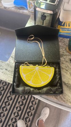 Original Dolli crystallized, lemon wedge clutch never been used