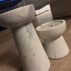 Set up two marble candleholders