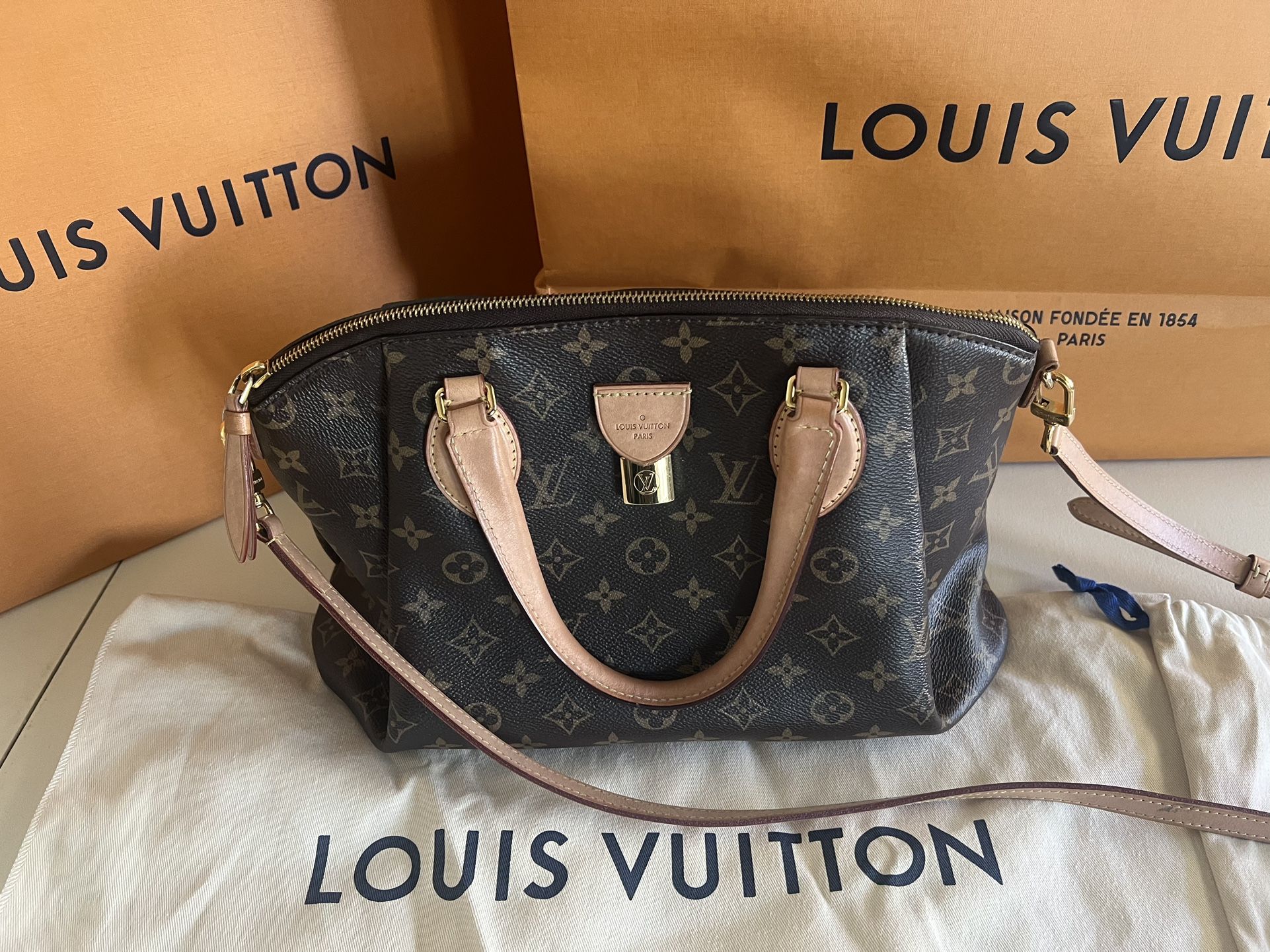 Louis Vuitton Rivoli MM Handbag