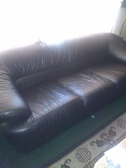 3 piece black leather sofa, loveseat and ottaman