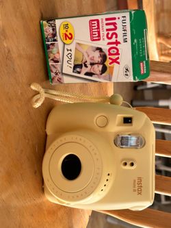 Fujifilm Instax Mini 8 camera with film